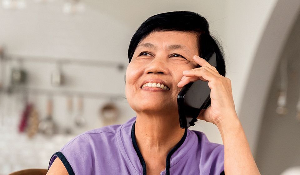 A woman talks on the phone