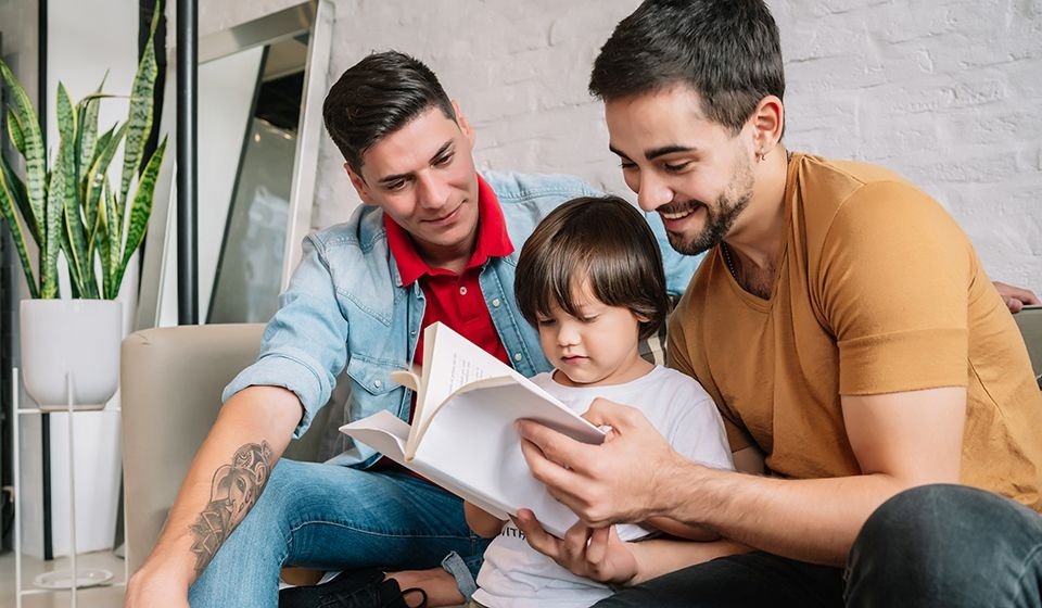 Parents read to a child